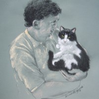 portrait of man holding black and white cat