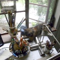 tortoiseshell cat on desl