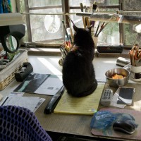 Mimi sits in the center of my desk demanding neatness and just a little personal attention.