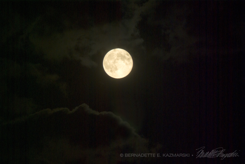 supermoon in clouds