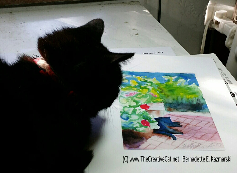 Mimi studies the painting of herself.