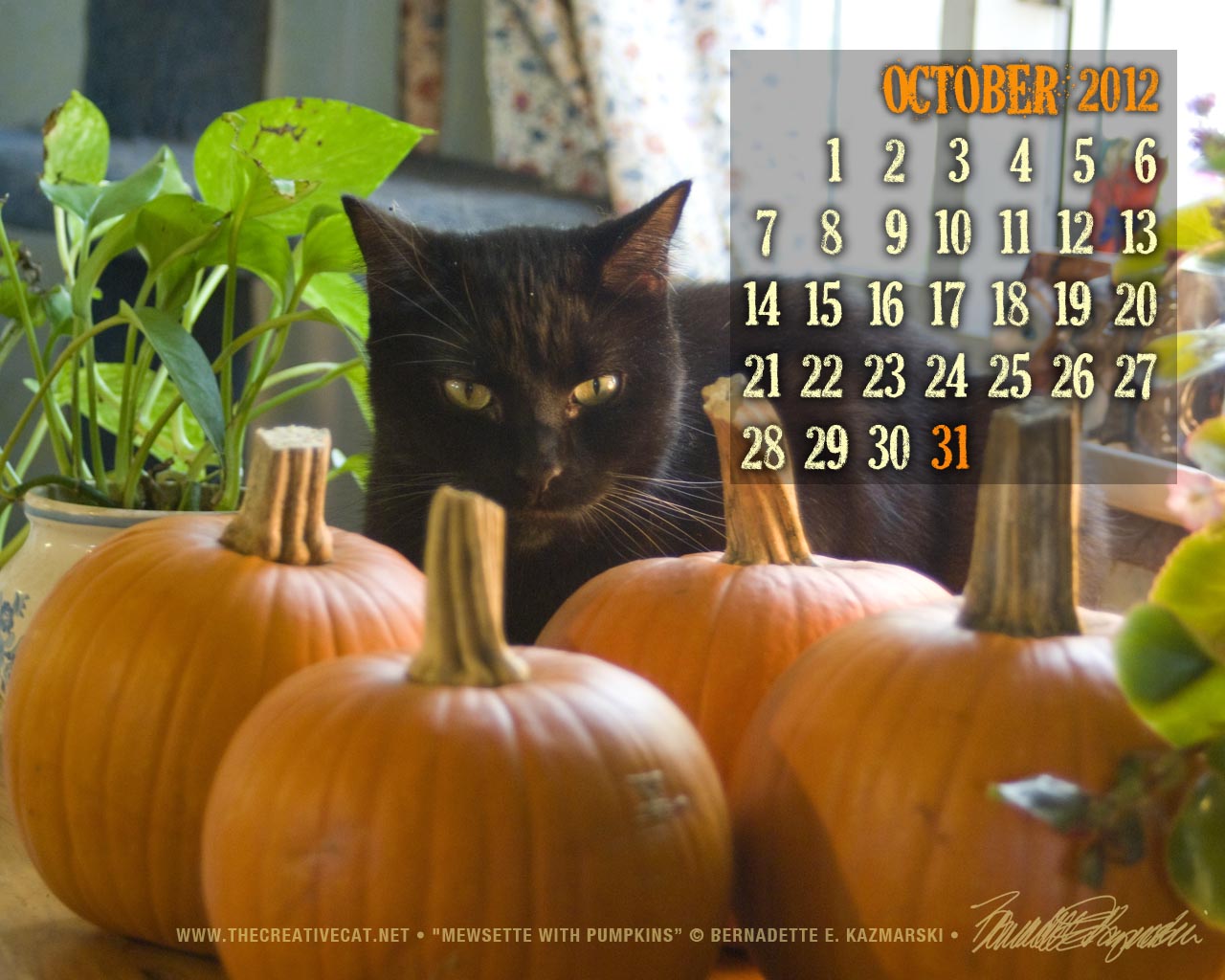 desktop calendar with black cat and pumpkins