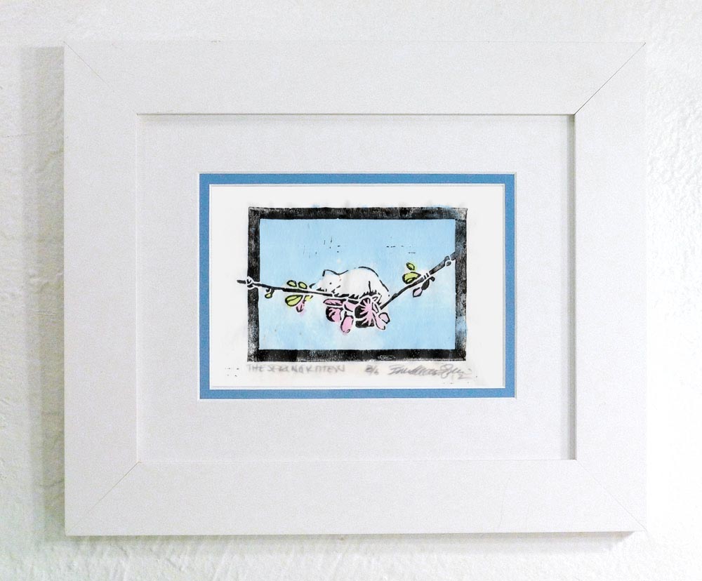 "The Spring Kitten" linoleum block print on rice paper, black ink and hand-colored with watercolors, white frame with blue and white mats