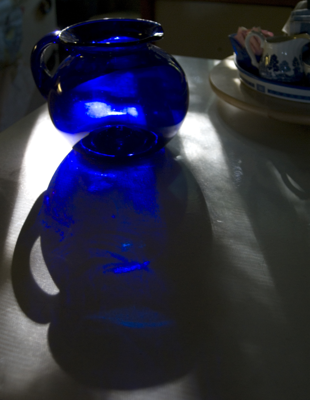 blue pitcher on table