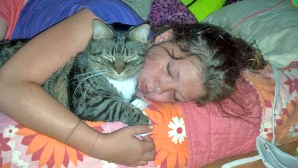 photo of girl and cat
