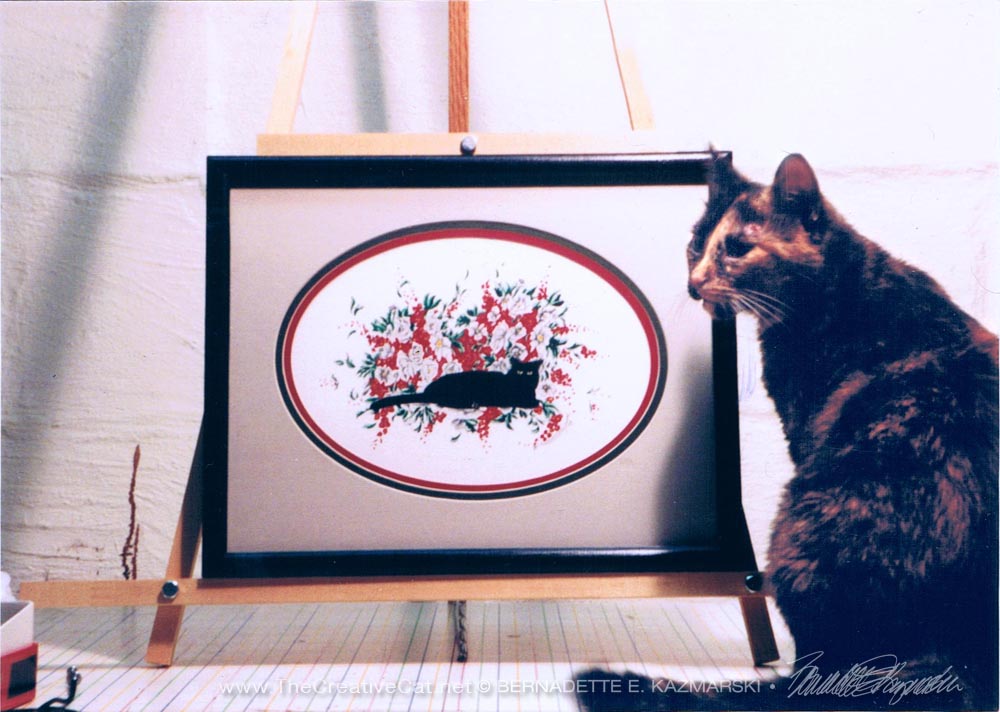 tortie cat with painting