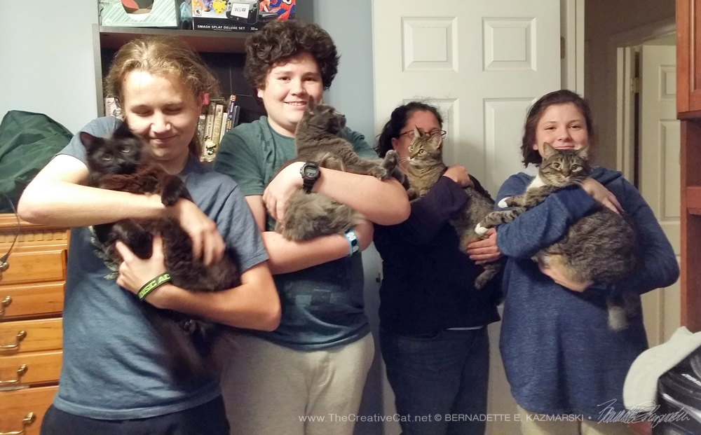 Happy family with all their cats!