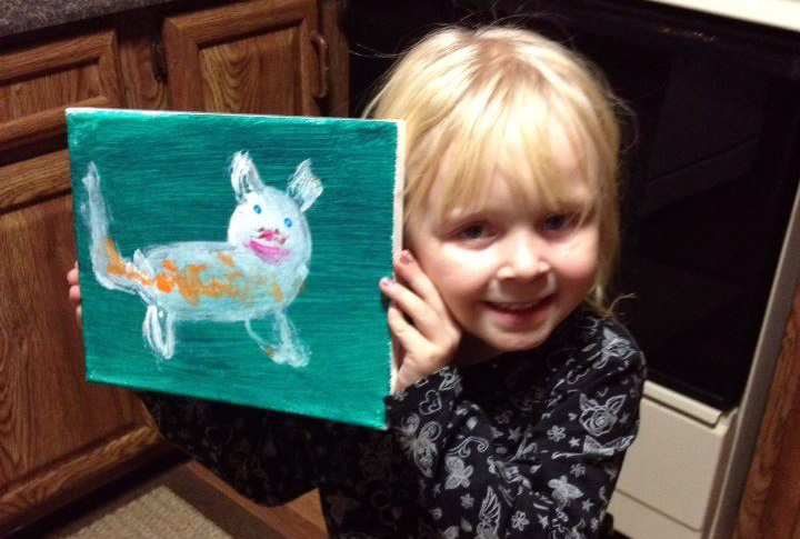 little girl with cat painting.