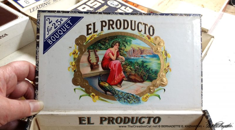 The detailed, colorful and embossed art on the inside of the El Producto box.