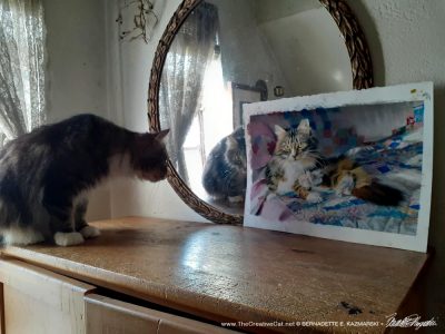 Mariposa looks at her painting