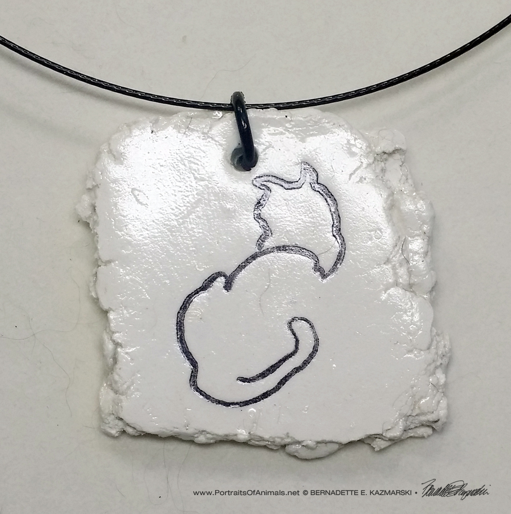 "Back to Front" pendant, 1.5" x 1.5" random on wire cord.