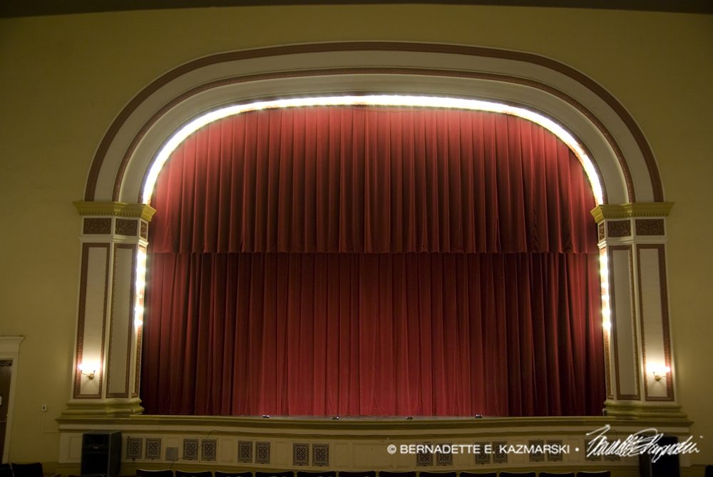 The proscenium and curtain of the stage at Andrew Carnegie Free Library Music Hall