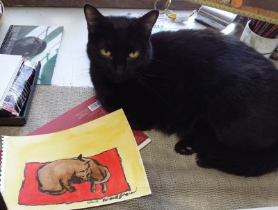 black cat with artwork