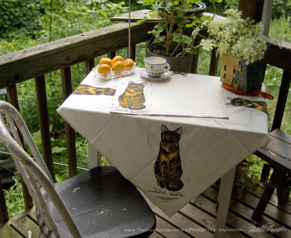 Tortie Girls tableset, The Roundest Eyes tablecloth and place mats.