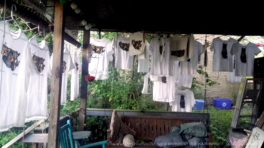 The hand-tinted tees drying all around my deck.