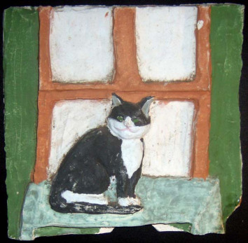 Bootsie on a ceramic tile from tenth-grade ceramics.